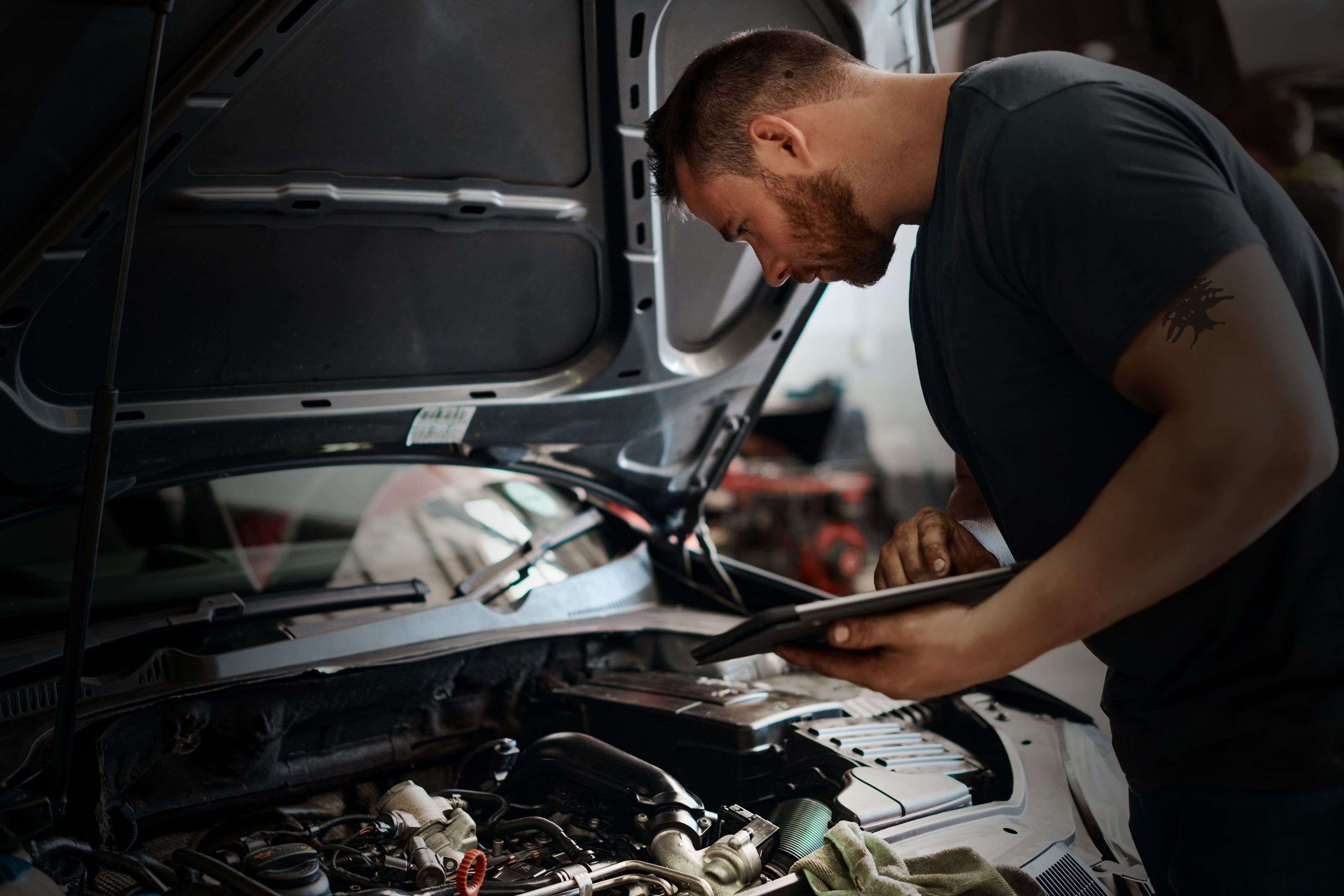 Mechanic working on porche car