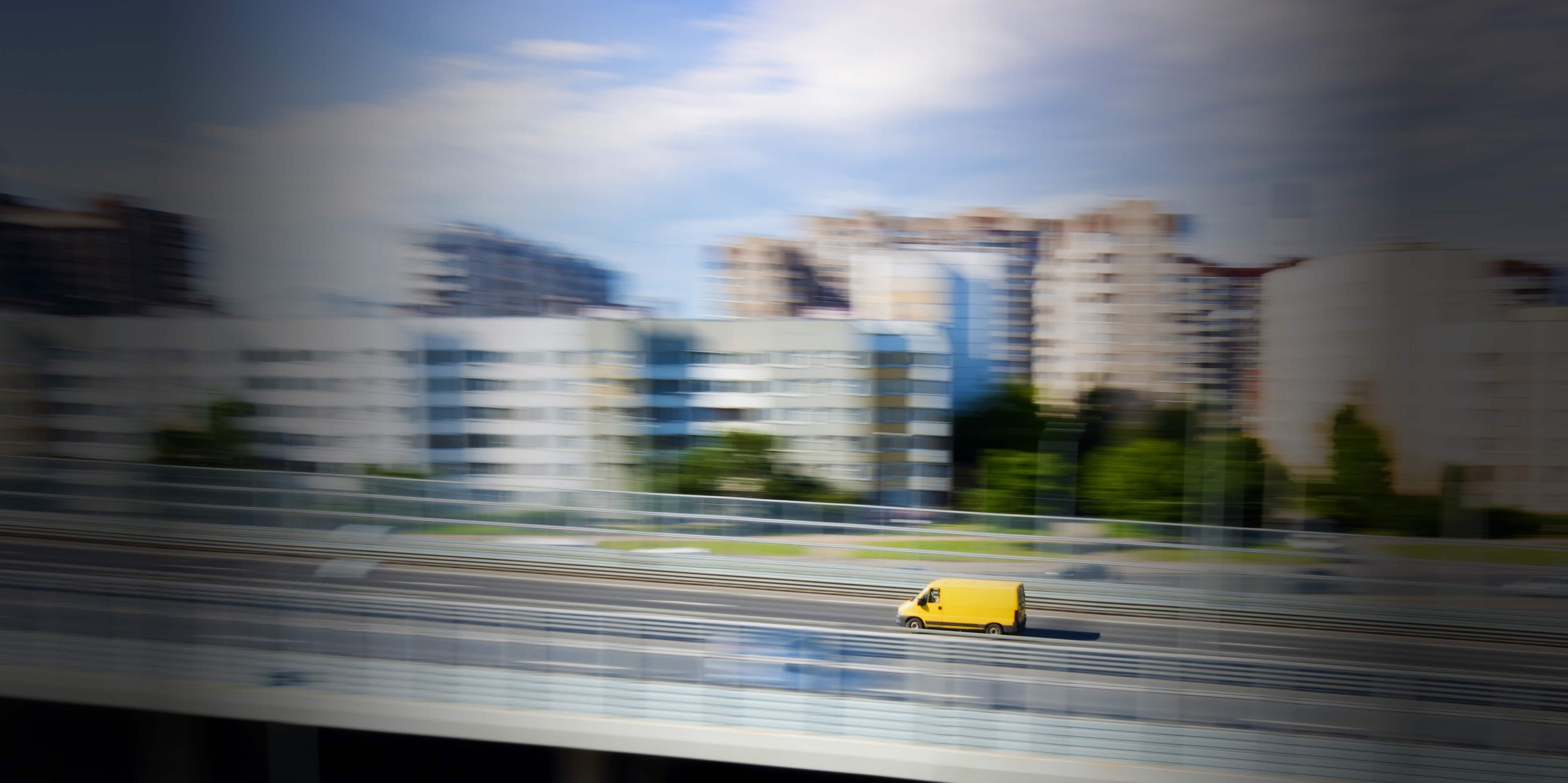 DHL truck driving over highway